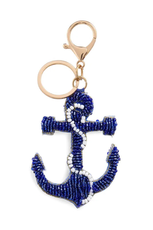 Blue beaded anchor keychain on a white background