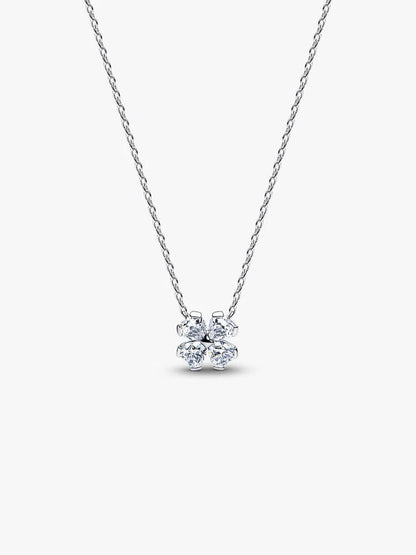 Silver necklace with a small pendant on a white background