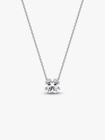 Silver necklace with a clover-shaped pendant on a white background