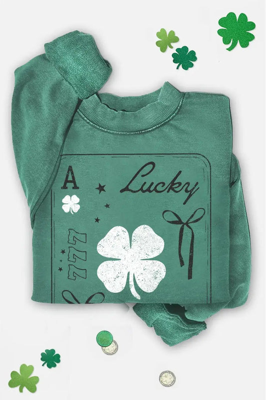 Green sweatshirt with 'Lucky' and shamrock design on a white background