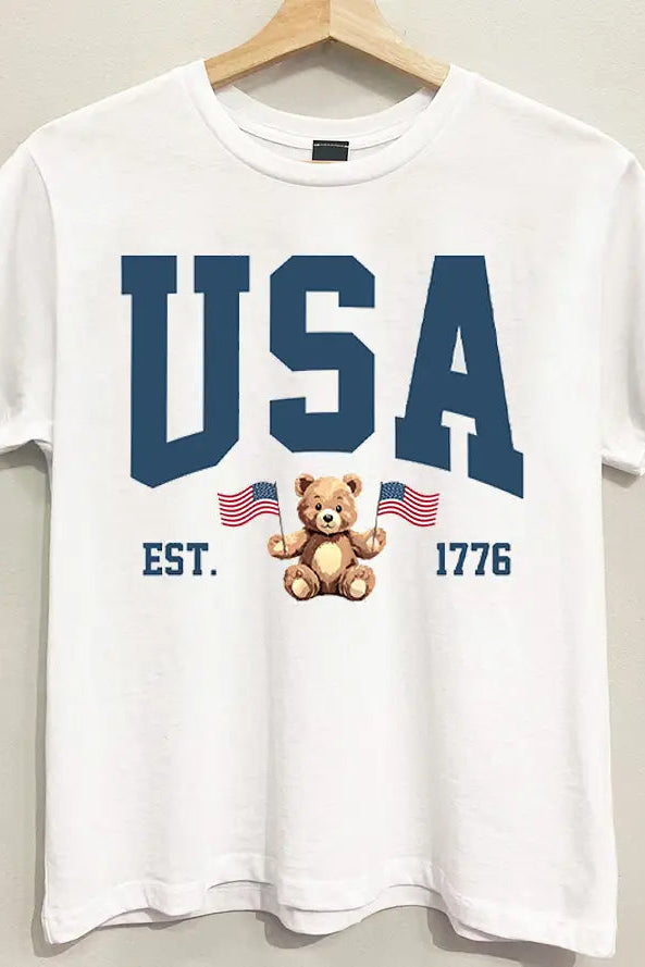 White t-shirt with 'USA' text and bear graphic on a hanger against a white background
