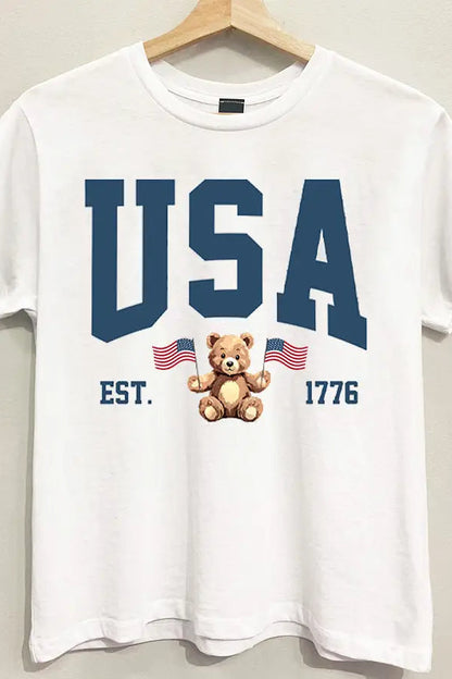 White t-shirt with 'USA' text and bear graphic on a hanger against a white background