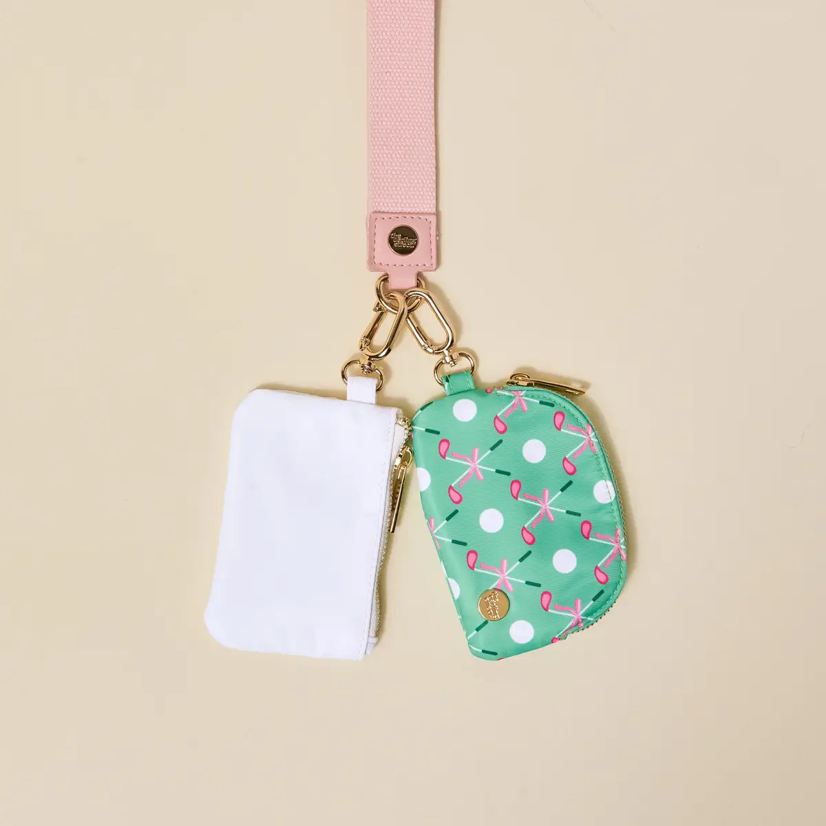 Two fabric pouches with a keychain on a beige background