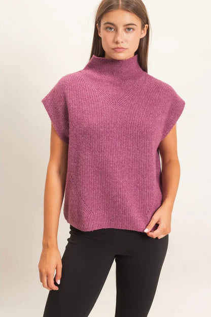 woman in high neck sweater and leggings