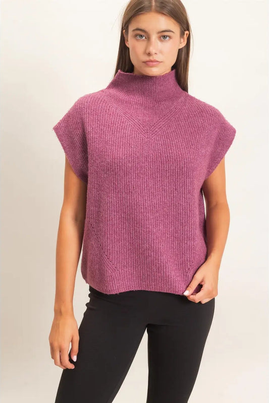 woman in high neck sweater and leggings