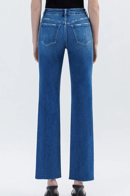 back view of person in medium wash jeans
