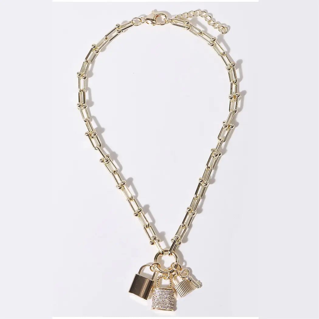Gold chain necklace with padlock charms on a white background