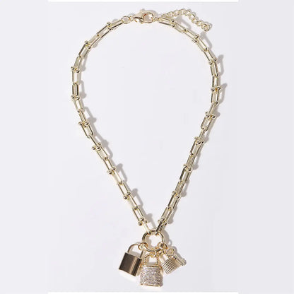 Gold chain necklace with padlock charms on a white background