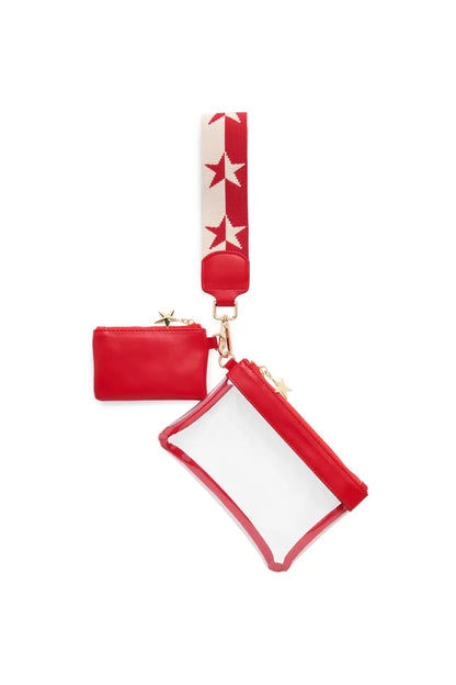 A red and white accessory set featuring a small red pouch, a clear zippered card holder with red trim, and a red and white wrist strap with white stars, all connected by gold-tone hardware.