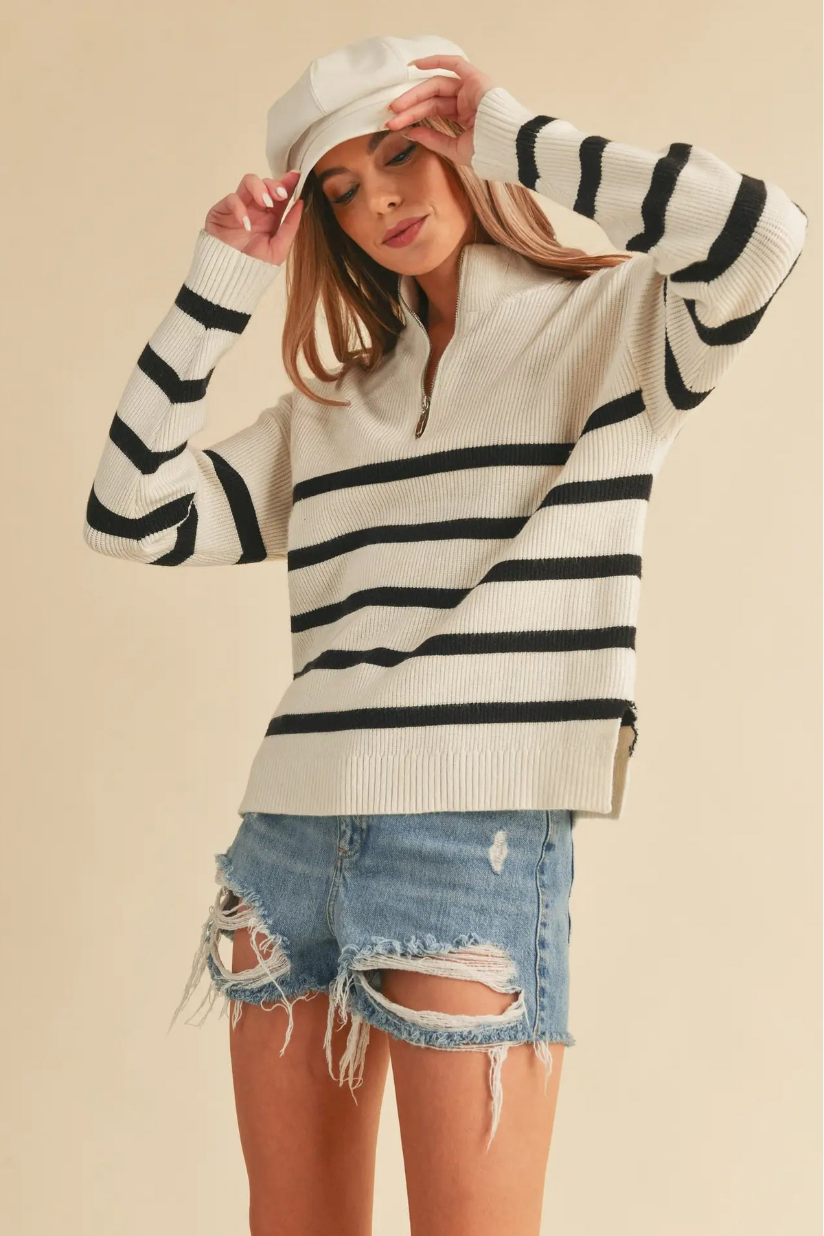 woman in half zip sweater and shorts