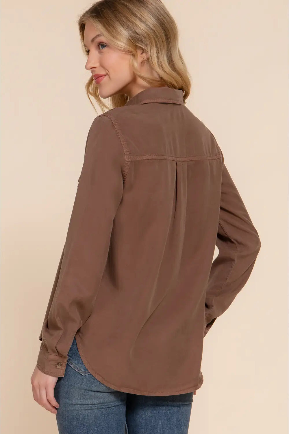 woman in button up shirt and jeans