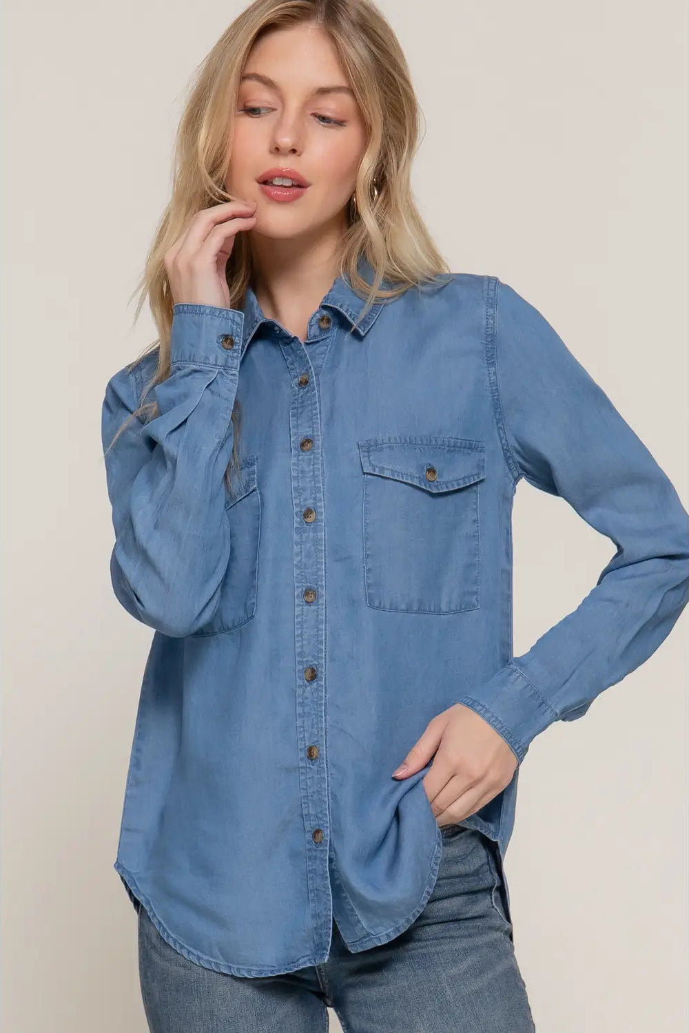 woman in button up shirt and jeans