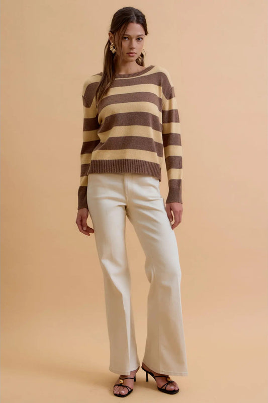 woman in striped sweater and pants
