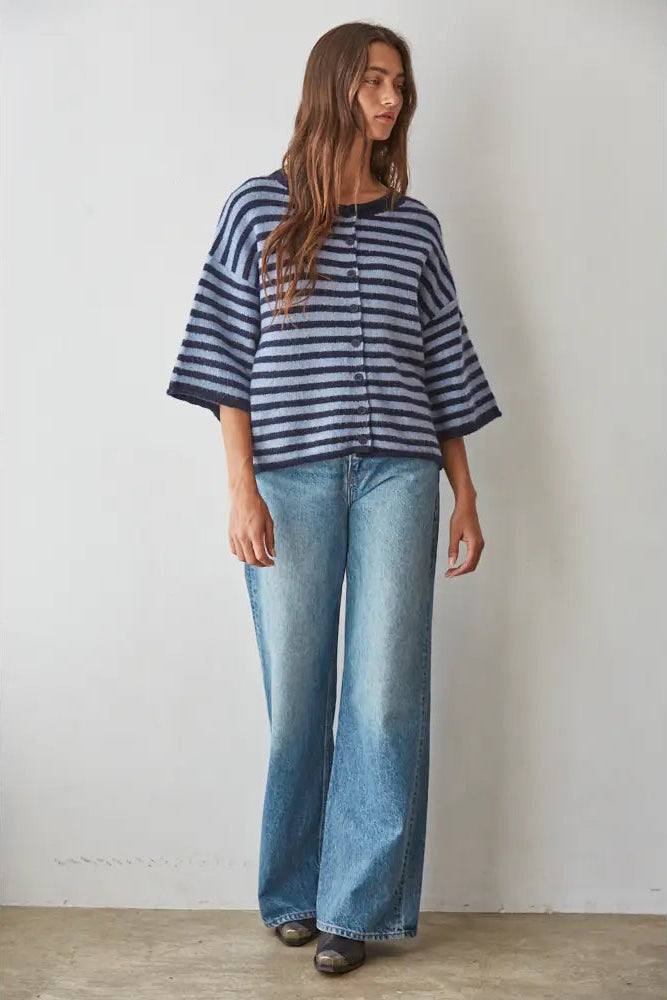 woman in blue striped sweater and jeans
