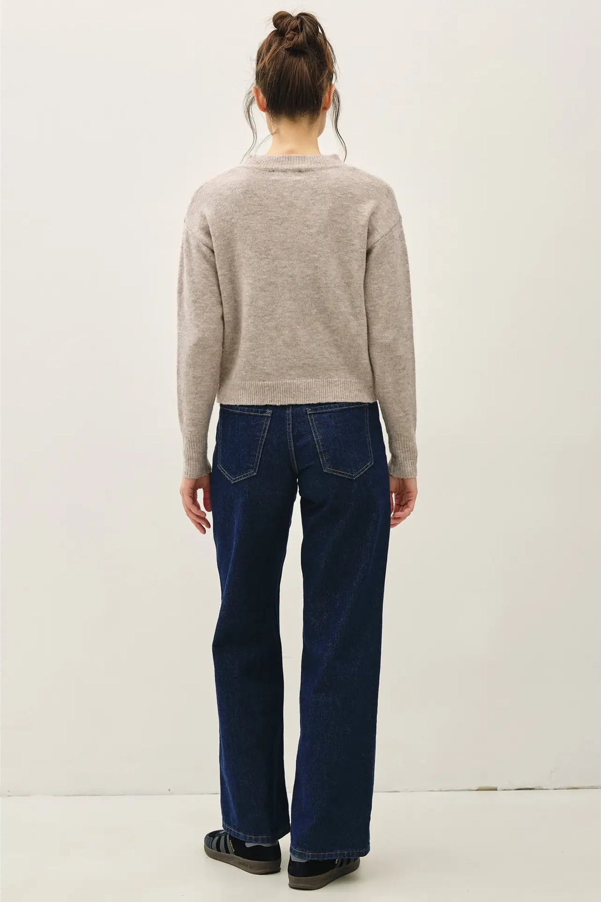 girl in gray sweater and jeans