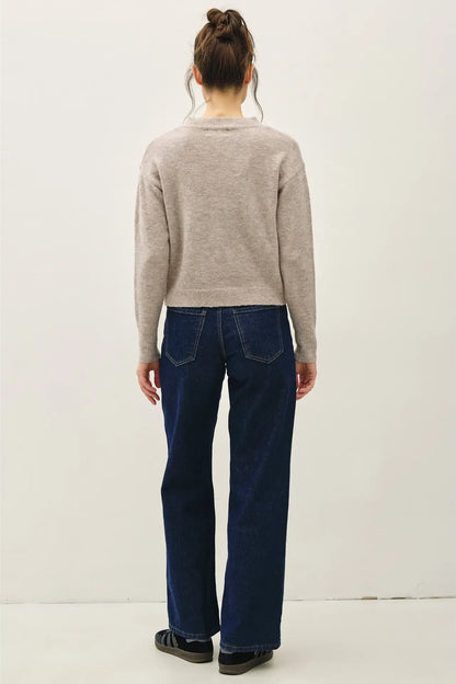 girl in gray sweater and jeans