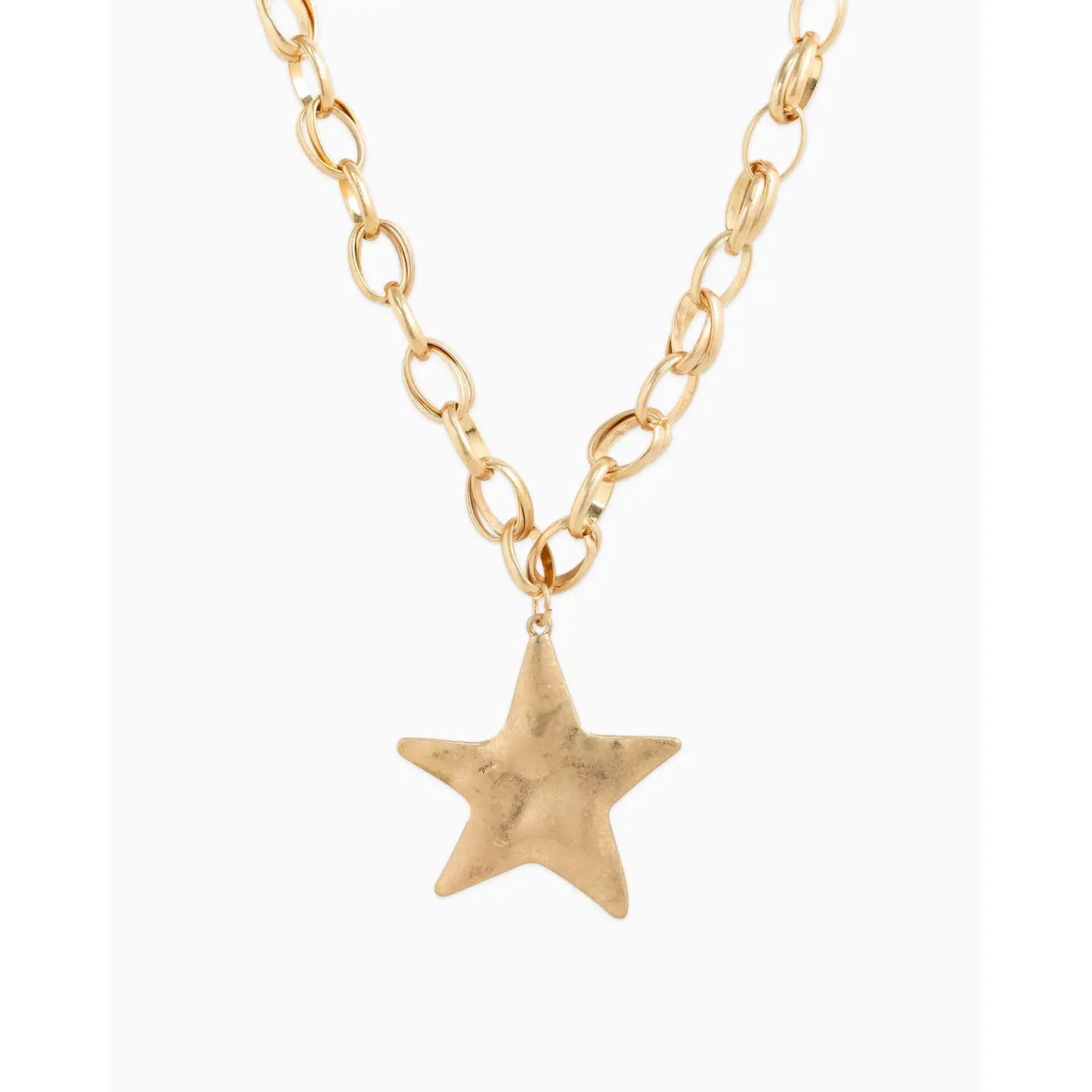 Gold star pendant necklace on a white background