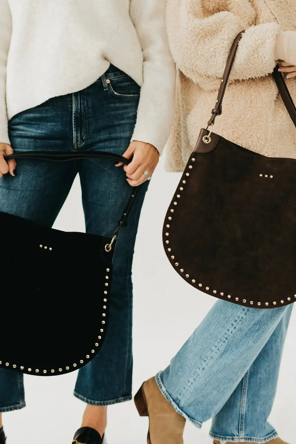 people holding hobo bags