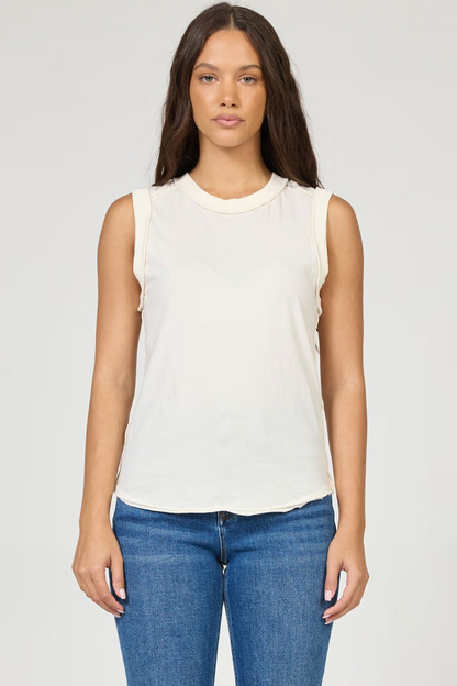 woman wearing cream tank with jeans 