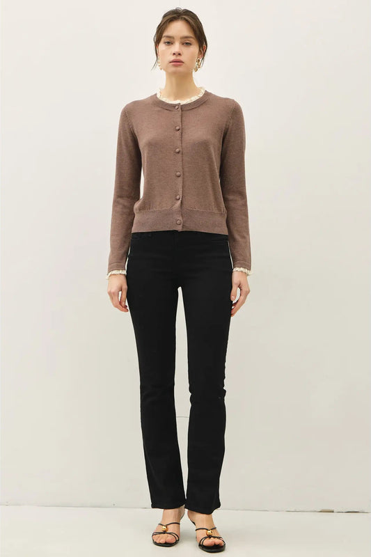 woman in lace trim cardigan and jeans