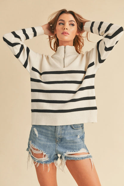 woman in striped half zip sweater and shorts