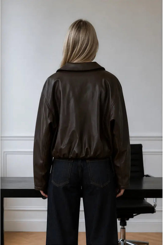 back view of woman in leather jacket
