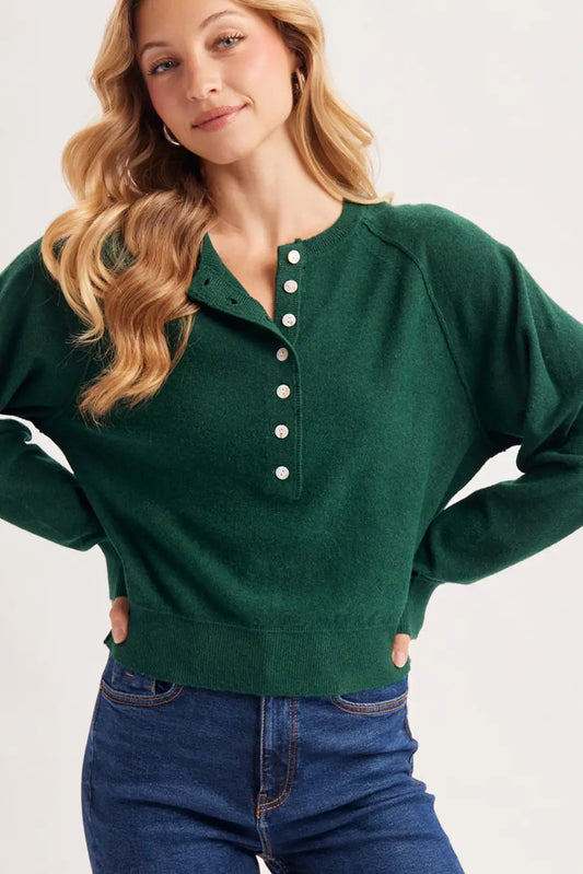 woman in henley sweater and jeans