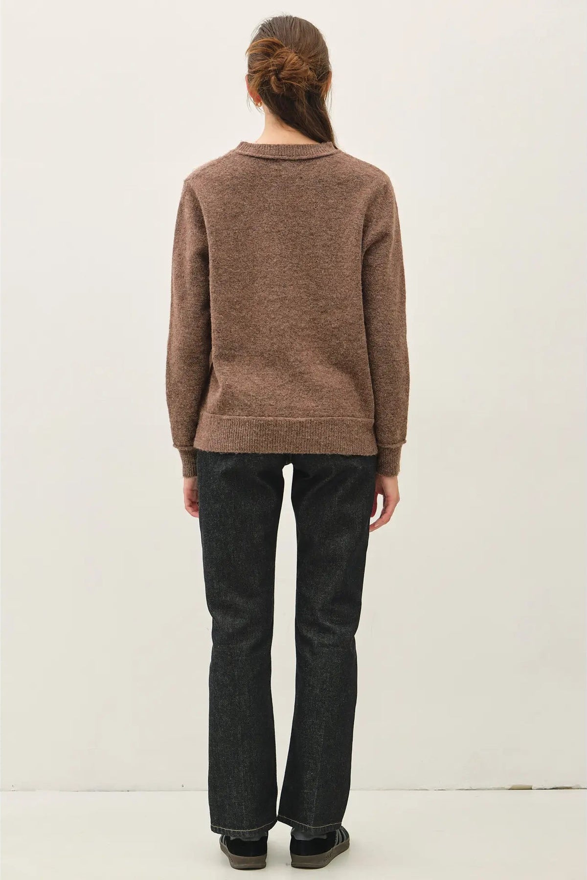 woman in sweater and jeans