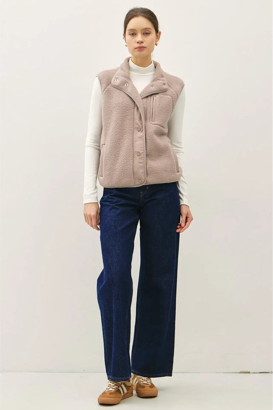 woman wearing fleece vest with jeans