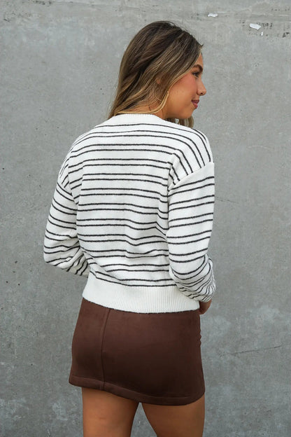 woman in striped cardigan