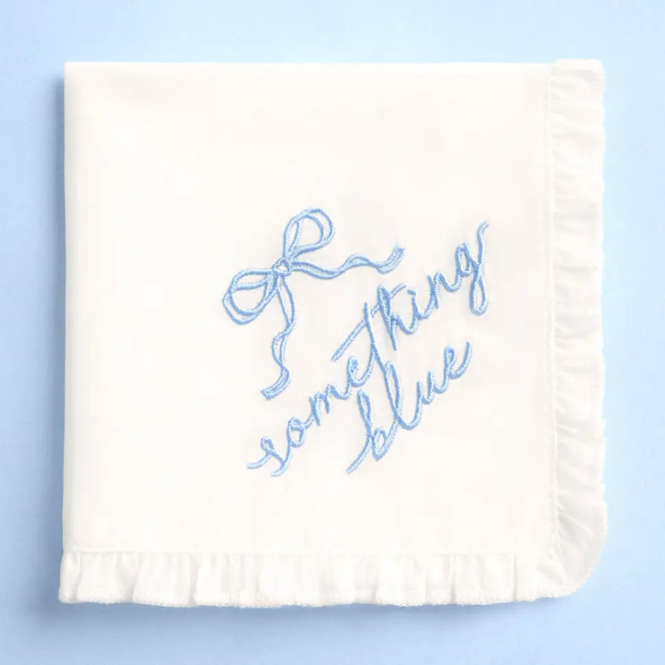 White blanket with blue text 'Something Blue' on a light blue background