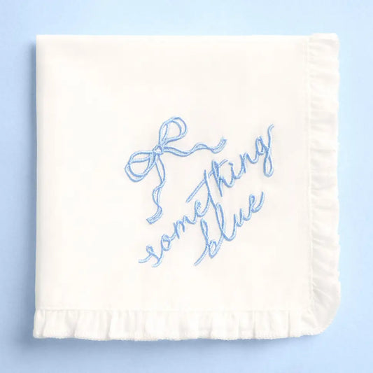 White blanket with blue text 'Something Blue' on a light blue background
