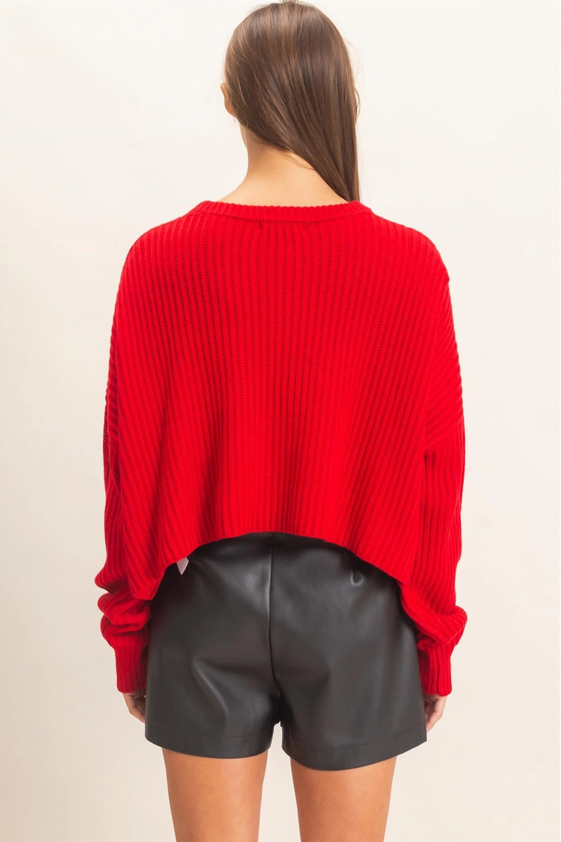 woman wearing red cropped sweater