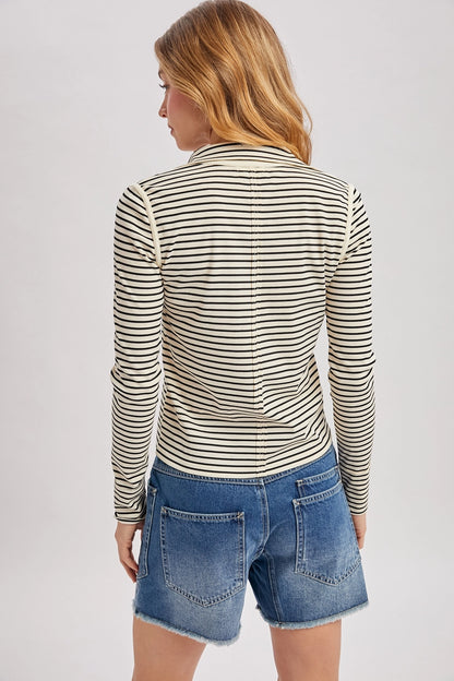 back view of woman in striped henley