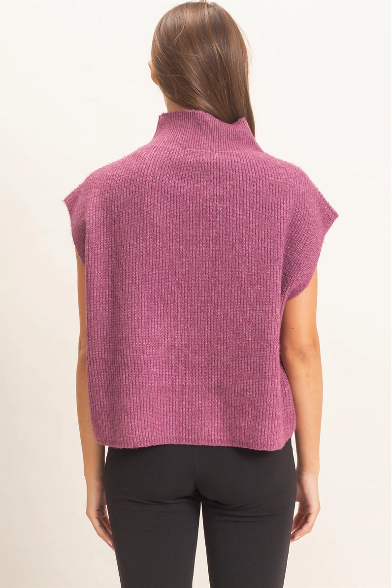 back view of woman in sweater and leggings