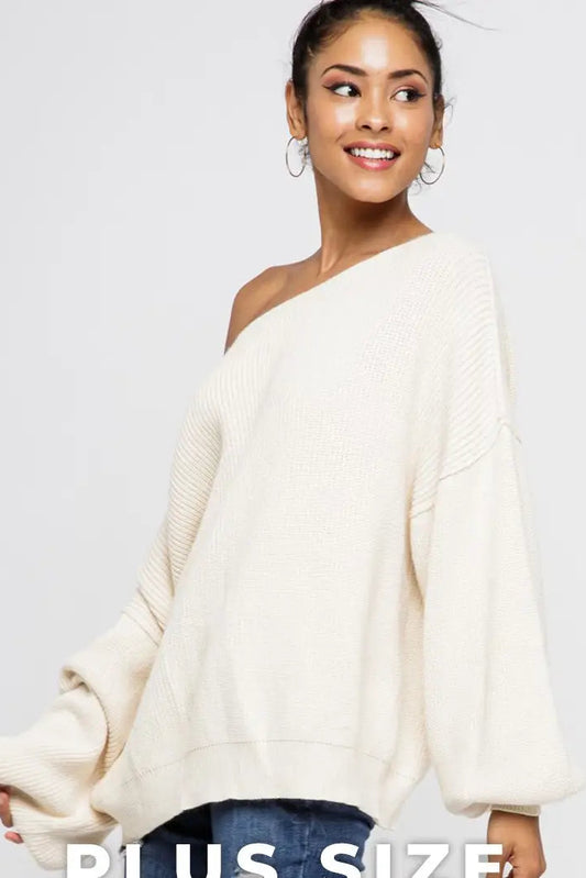 woman wearing off shoulder cream sweater