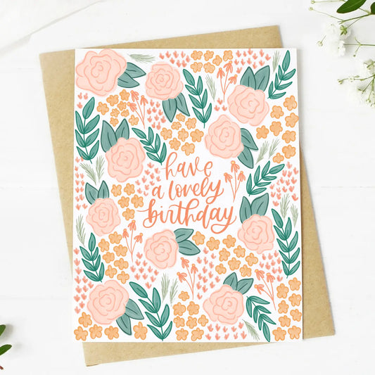 Greeting card with floral design and 'have a lovely birthday' text on a white background