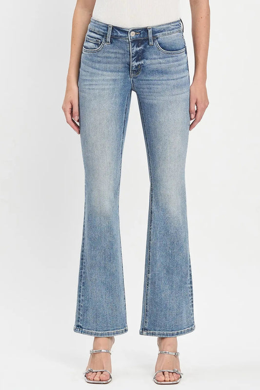 person in light wash jeans