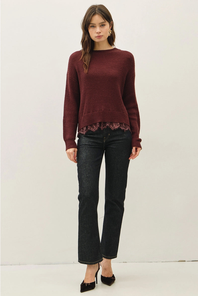 woman in lace trimmed sweater and jeans