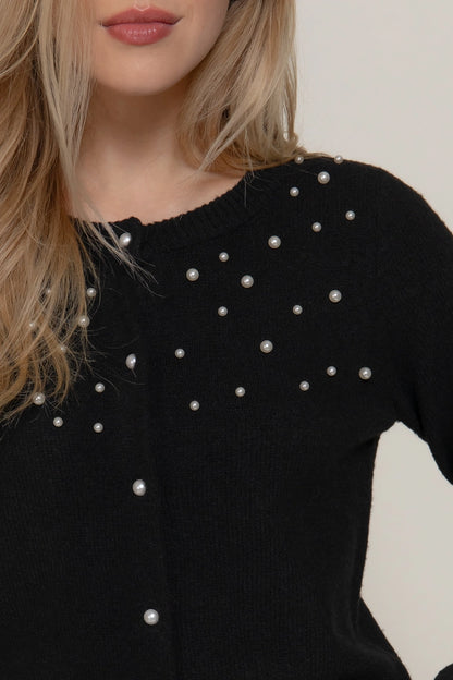 woman in pearl cardigan 