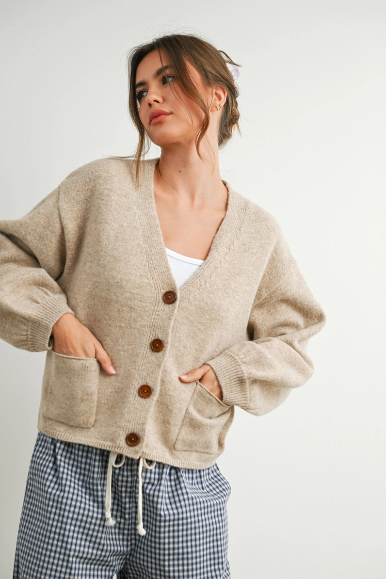 woman in taupe cardi