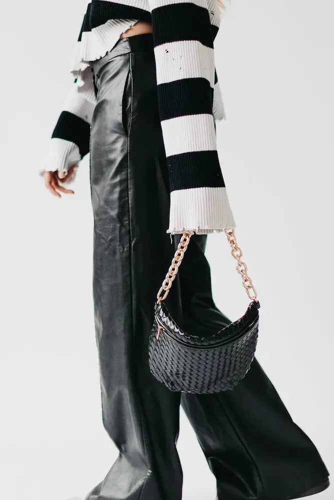 person holding purse