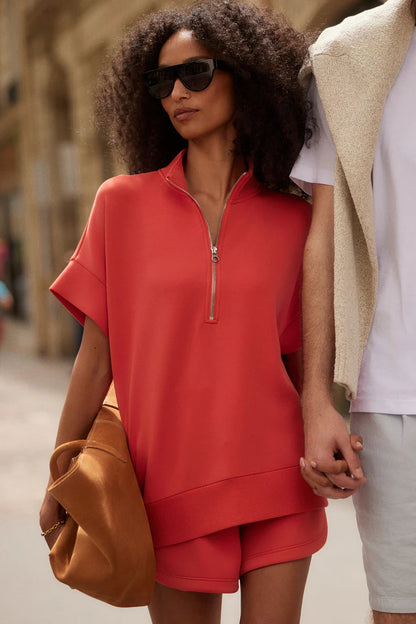 woman wearing red top and red shorts