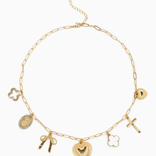 Gold necklace with various charms on a white background