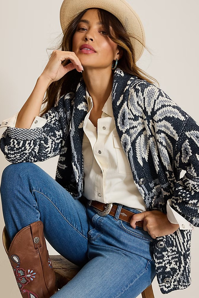 woman wearing blue print cardi with jeans and boots