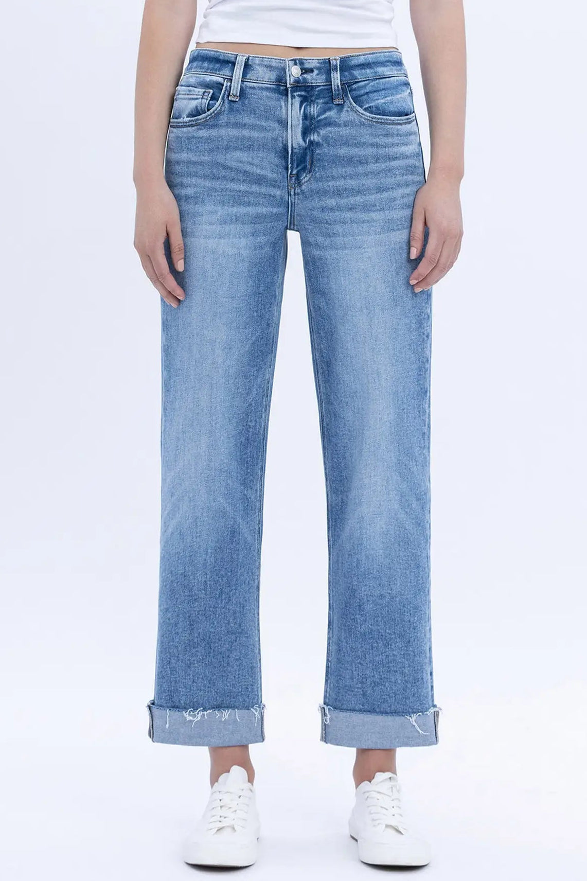 Light blue jeans worn by a person on a white background