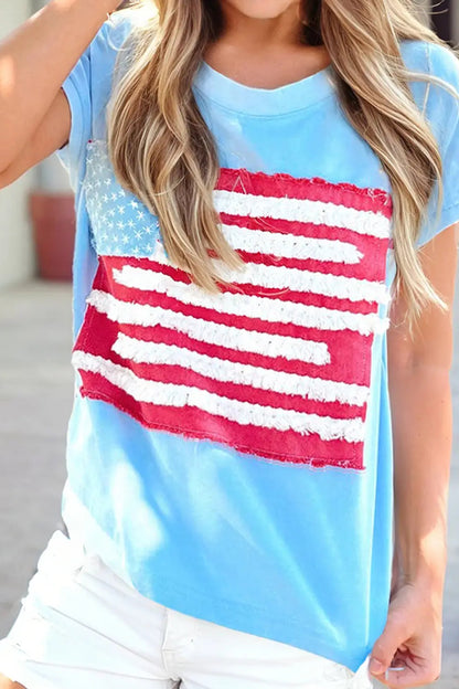 Person wearing a blue t-shirt with an American flag design.