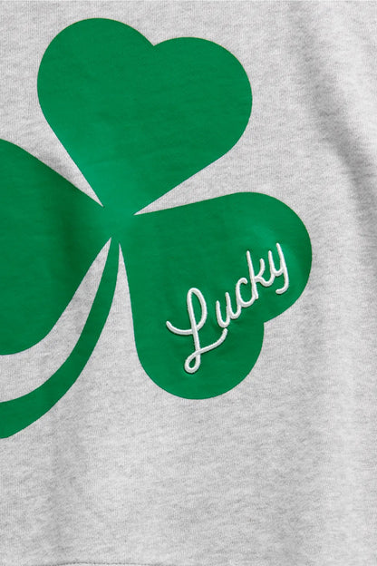 Green shamrock with 'Lucky' text on a gray background