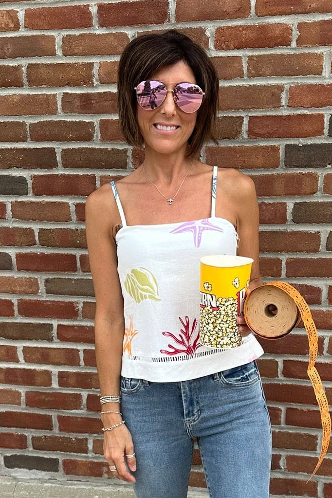 woman wearing coral reef tank with jeans
