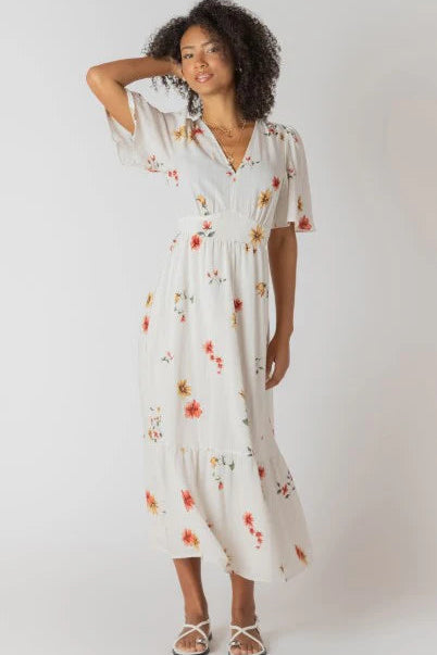 Woman wearing a floral dress on a white background